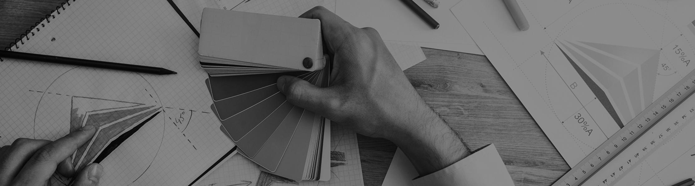 Graphic showing a person holding swatches of colour and designs on paper 