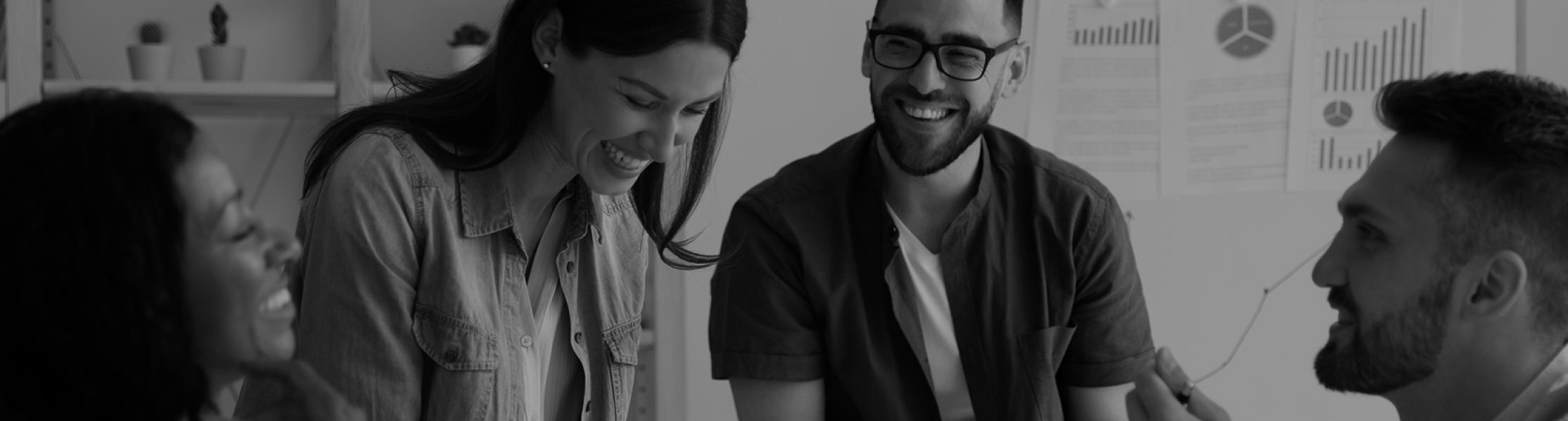 Graphic showing people around a table having a discussion and laughing 