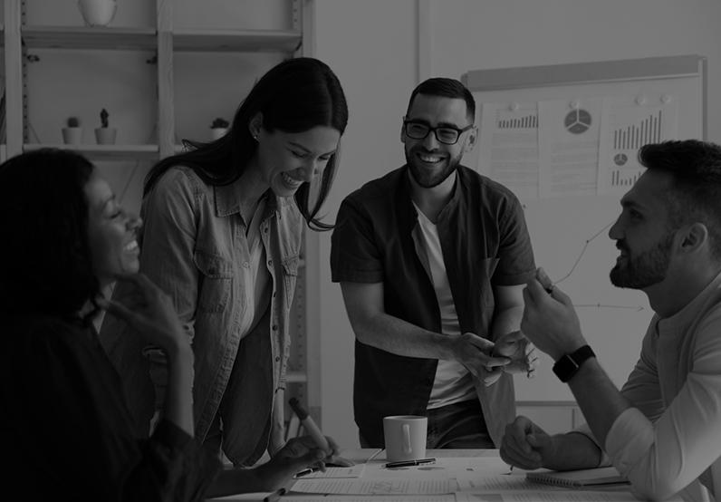 Graphic showing people around a table having a discussion and laughing 